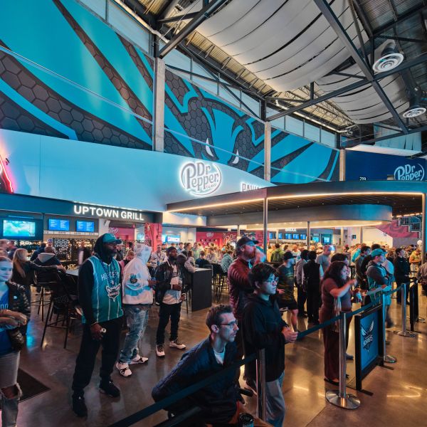 Basketball fans in the Dr. Pepper Pavillion during a Charlotte Hornets game at Spectrum Center