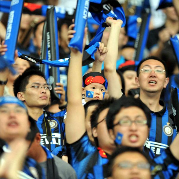Semi close up shot of Inter Milan fans in the stands