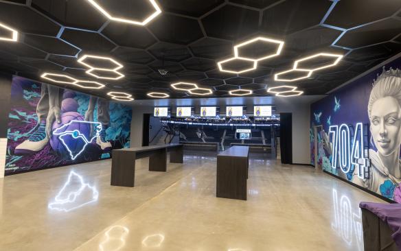 The murals and gathering space by the renovated Baseline Bar at Spectrum Center