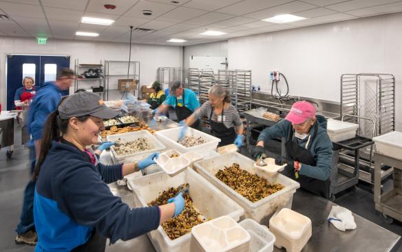 Volunteers working at the Food Bank of the Rockies distribution center