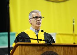 Marc Farha giving a commencement speech at a Wichita State University commencement ceremony