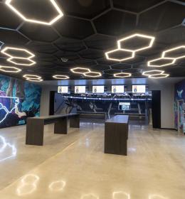The murals and gathering space by the renovated Baseline Bar at Spectrum Center