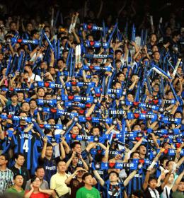 Inter Milan fans holding up scarves that say "I love Inter"