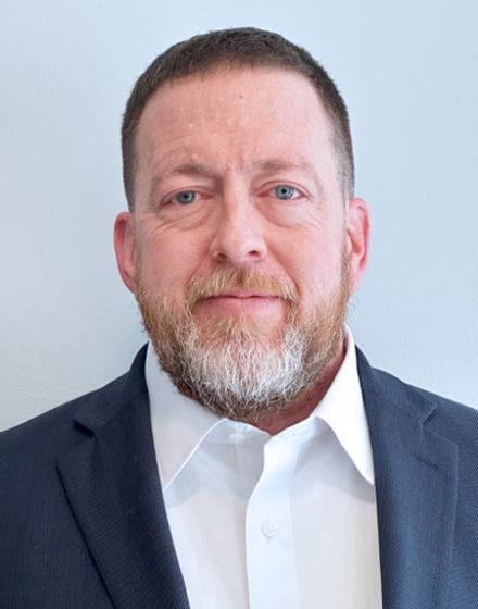Headshot of Chris Daly
